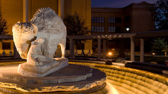 The Original Texan's marble sculpture in the Pedestrian Mall.